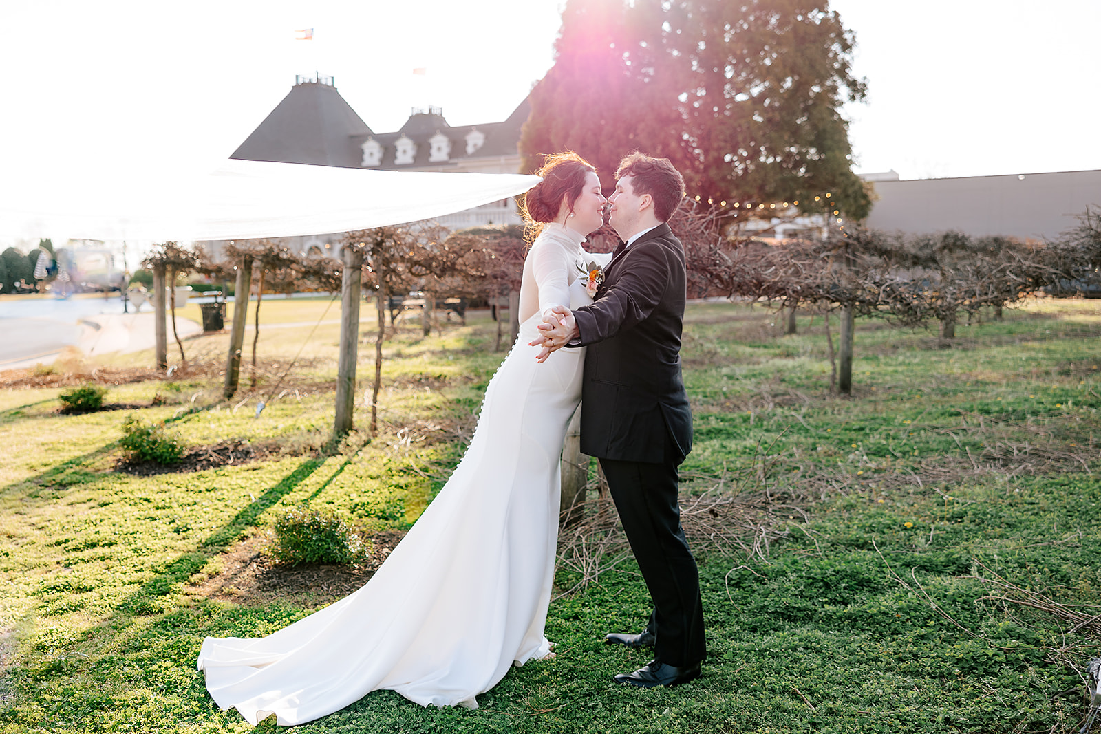 chateau elan winery bride and groom kissing